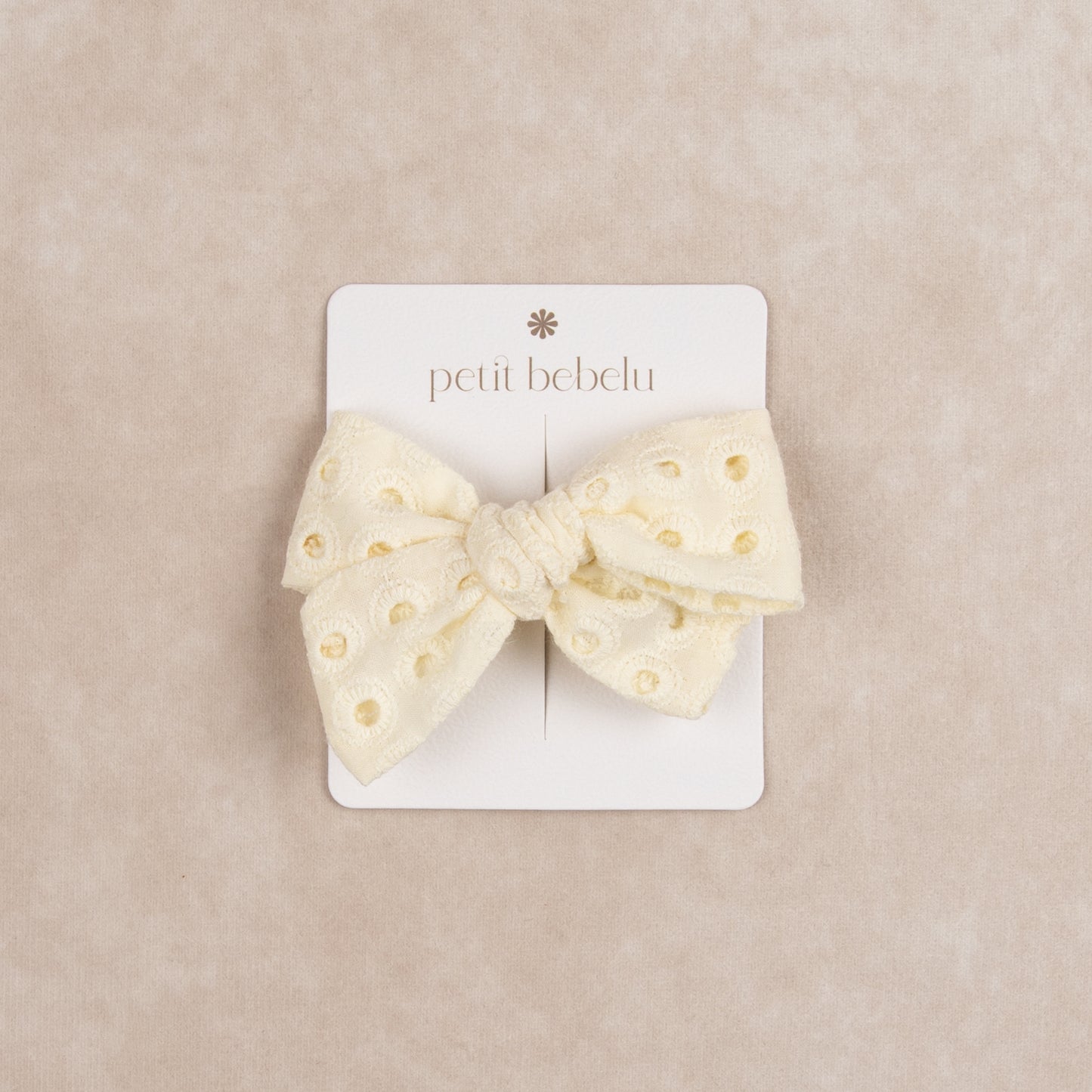 eyelet bow | ivory